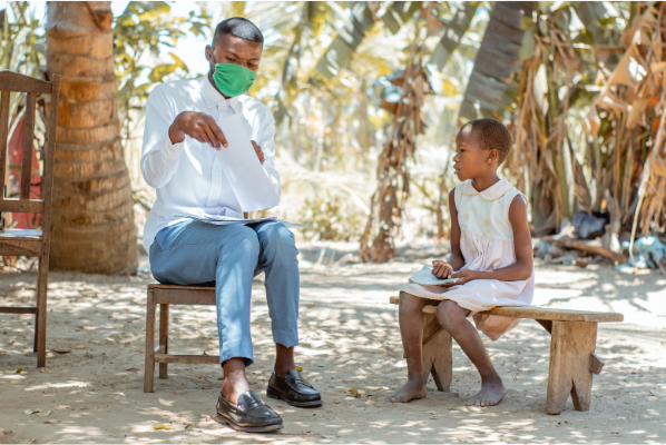 Camila and her teacher Marito. Camila attends Life Child Peace school in Mozambique.